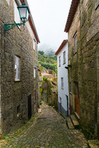 mossy cobblestone path - Old street in village of Monsanto, Portugal