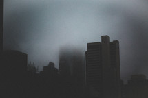 skyscrapers in fog 