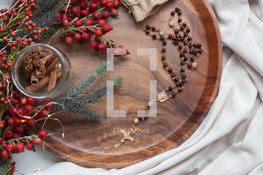 rosary in a wooden tray at Christmas 