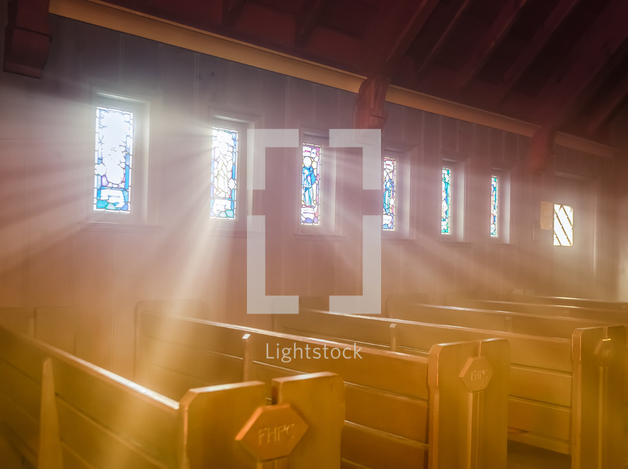 rays of sunlight shining through stained glass windows