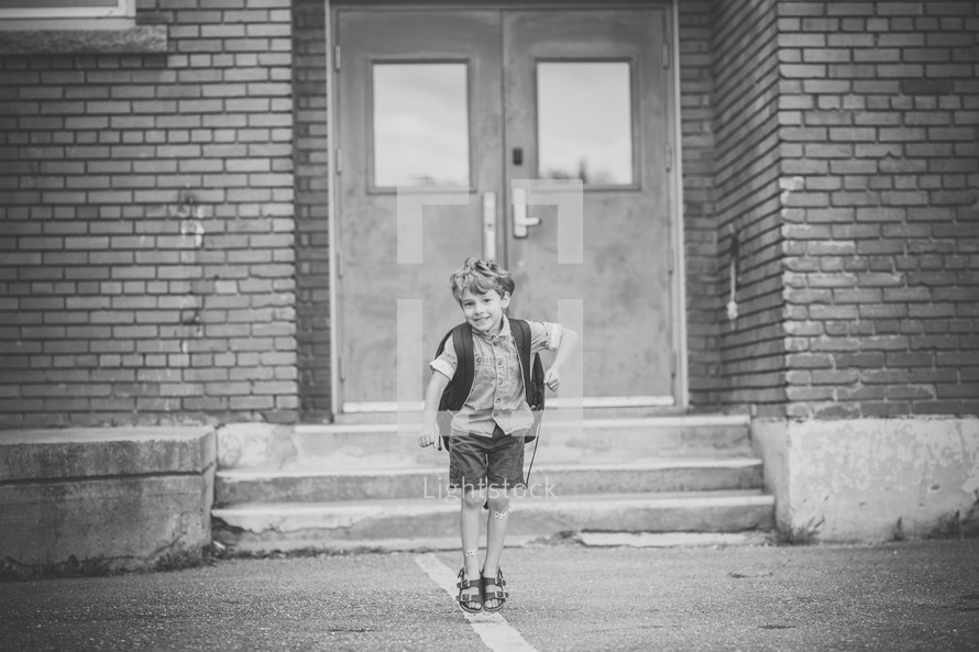 a boy entering a school 