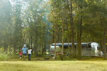 a family walking towards their camper