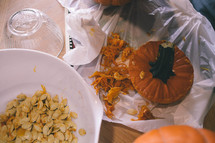 taking seeds out of a pumpkin 