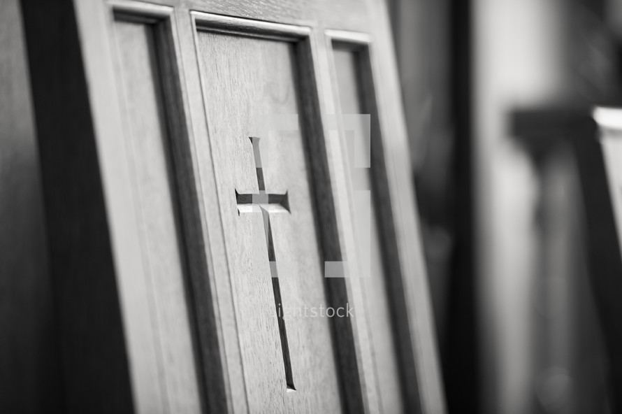 Cross inscribed in wood door