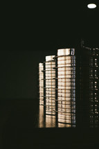 Light shining on stacks of communion trays.