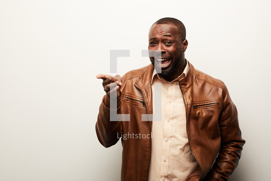 an African American man pointing 