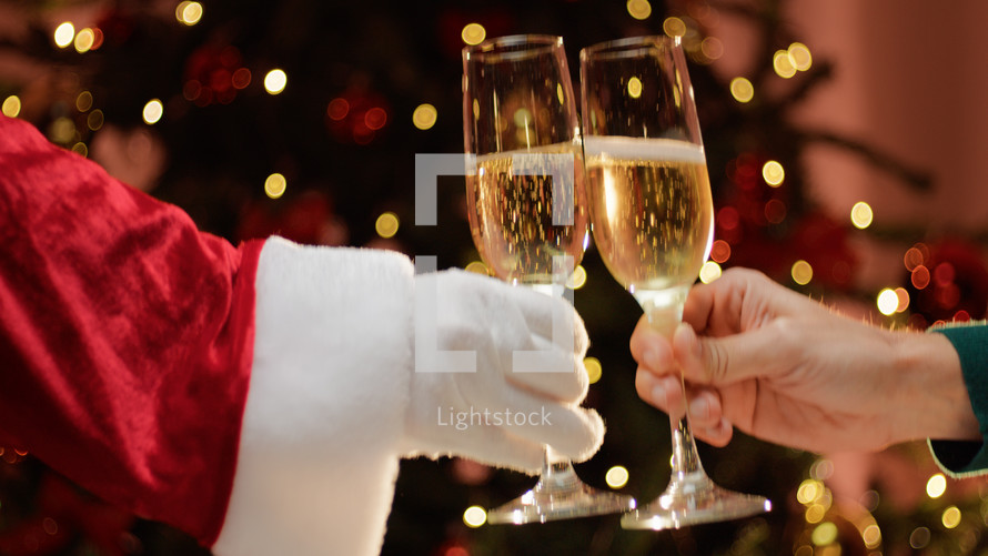 Santa Claus making a toast with a family member 