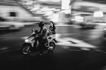 man and woman on a motorcycle in Thailand 