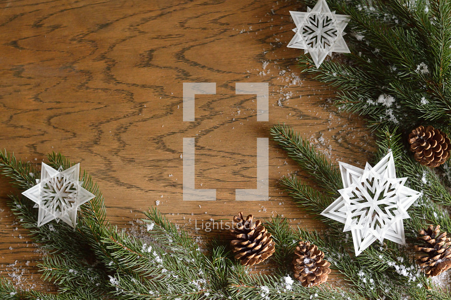 star ornaments, pine cones, and pine boughs 