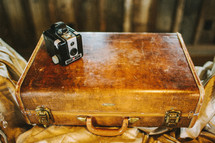 antique box camera and suitcase