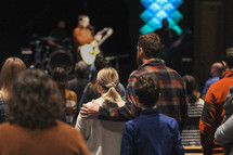 a couple during a worship service 