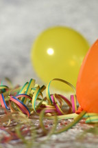 confetti, ribbon, and balloons 