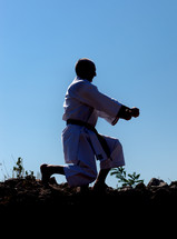 Adult man practicing Karate outdoors