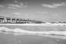 waves in the ocean and a pier 