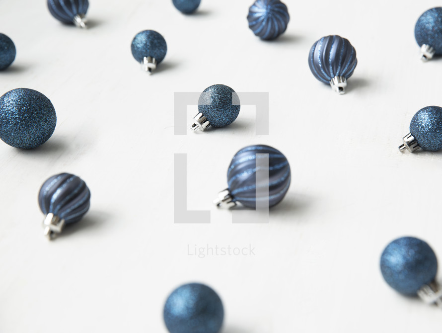blue Christmas ornaments on white 