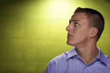 side profile of a man looking up 