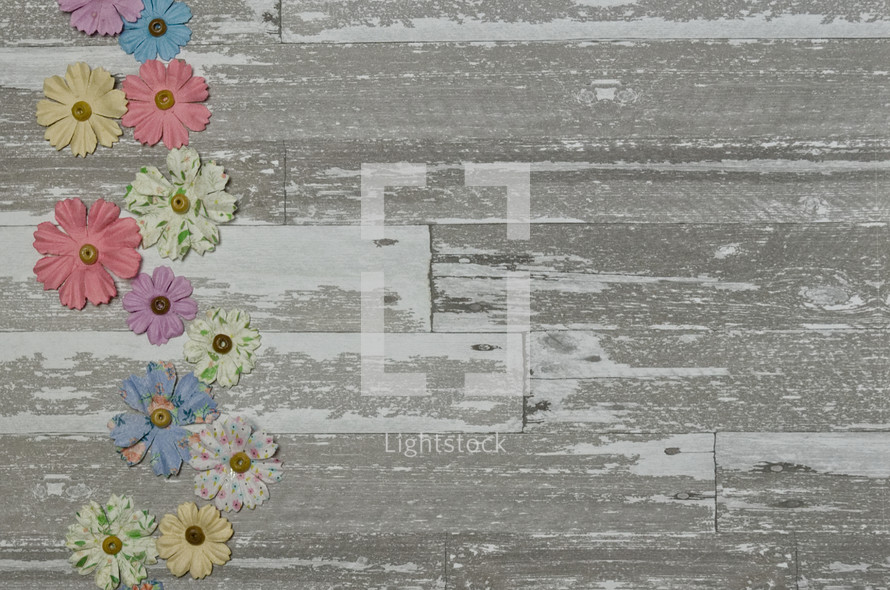 fabric flowers on a wood background 
