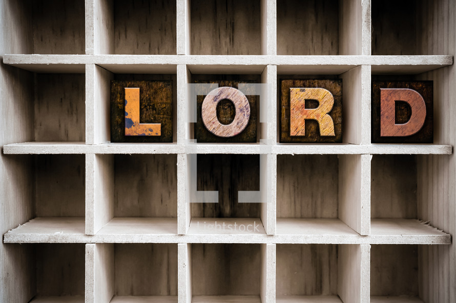 word lord on a wood shelf 