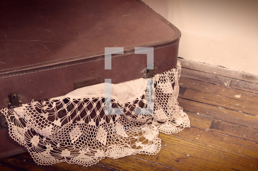 lace doily in a suitcase 