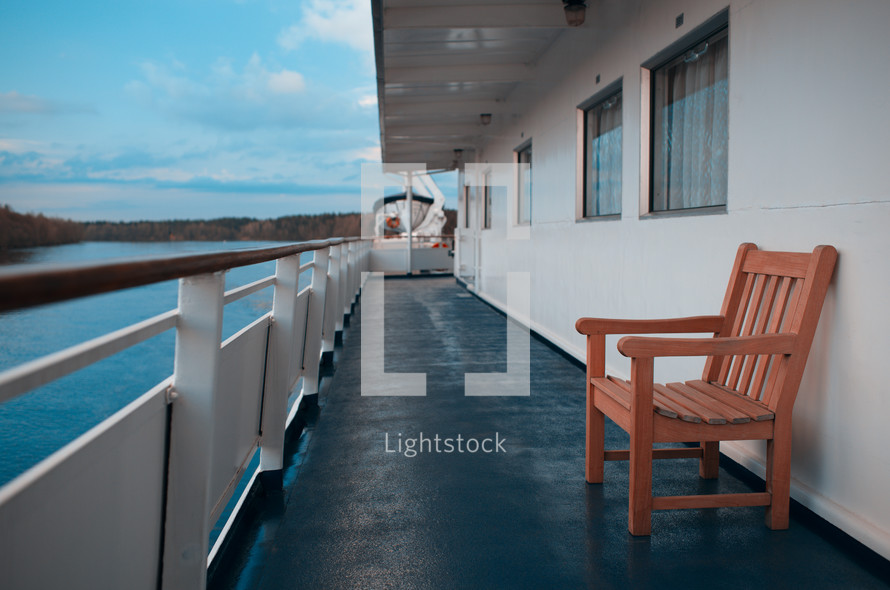 Wooden chairs on the deck of cruise liner