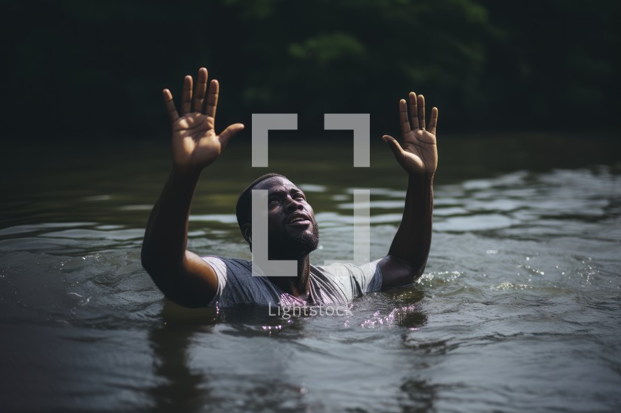 Baptism. Black Man in worship in a river