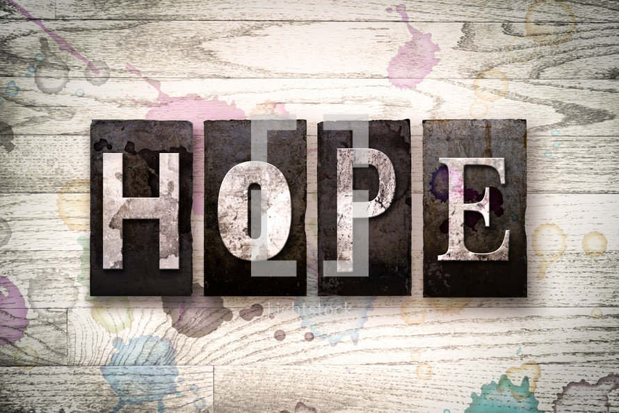 word hope on wood background 