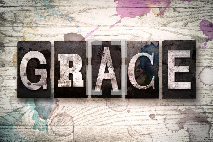 word grace on white washed wood