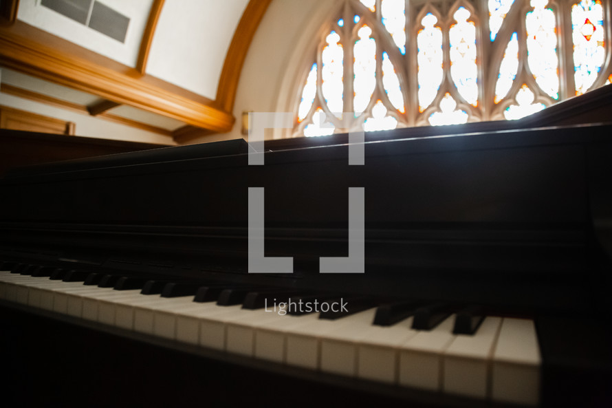 piano and stained glass windows 