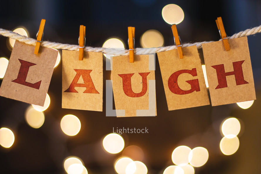 word laugh hanging on clothes pins 