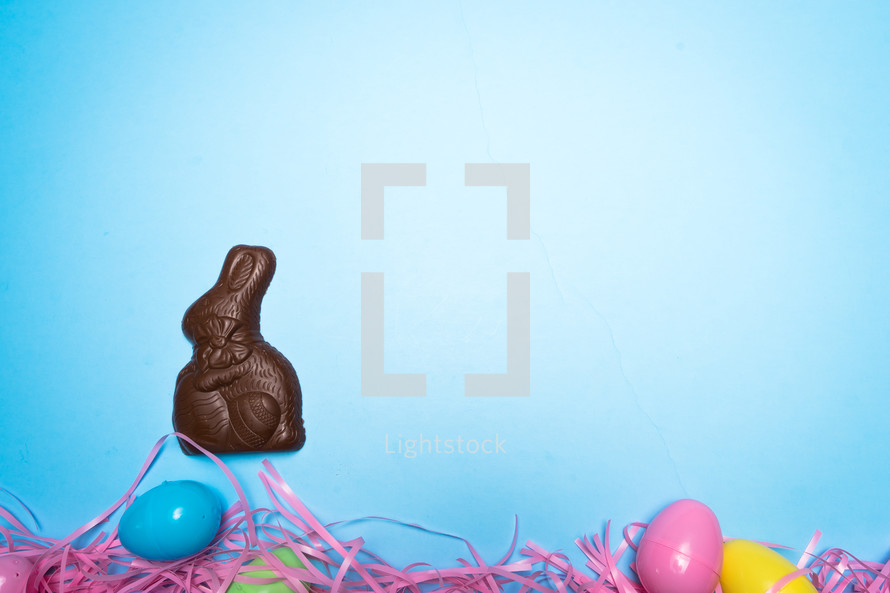 chocolate Easter rabbit over Easter eggs 