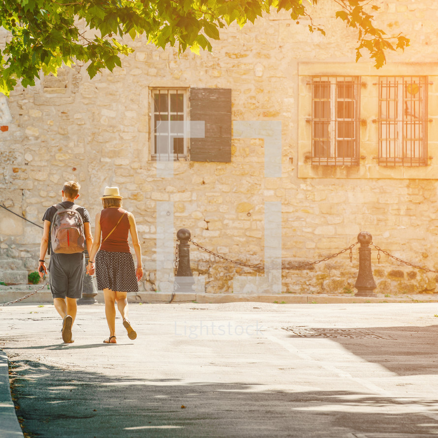 couple walking in Arles, France