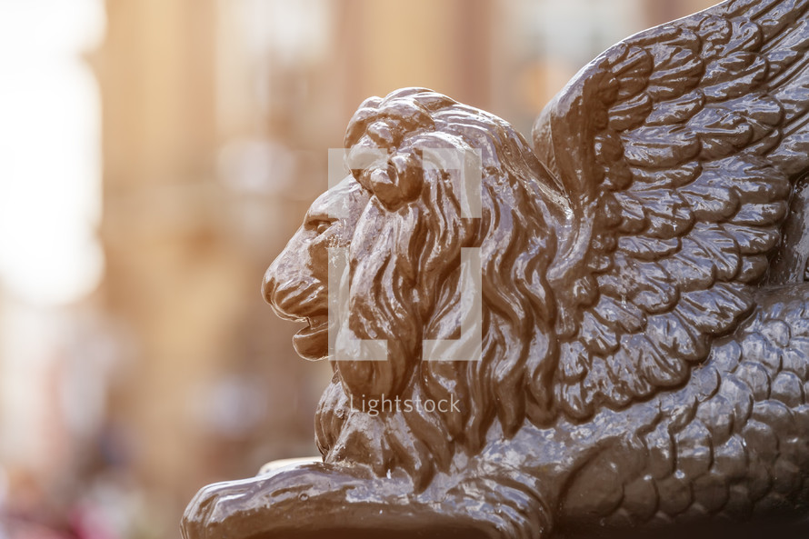 statue of a lion with wings 