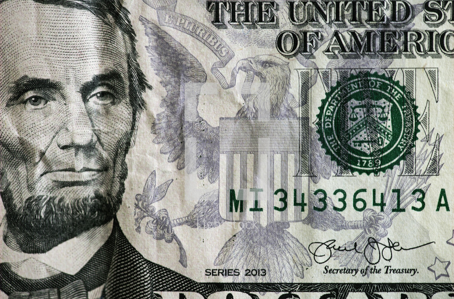 Abraham Lincoln of a five dollar bill 