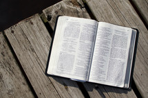 open Bible on a dock 