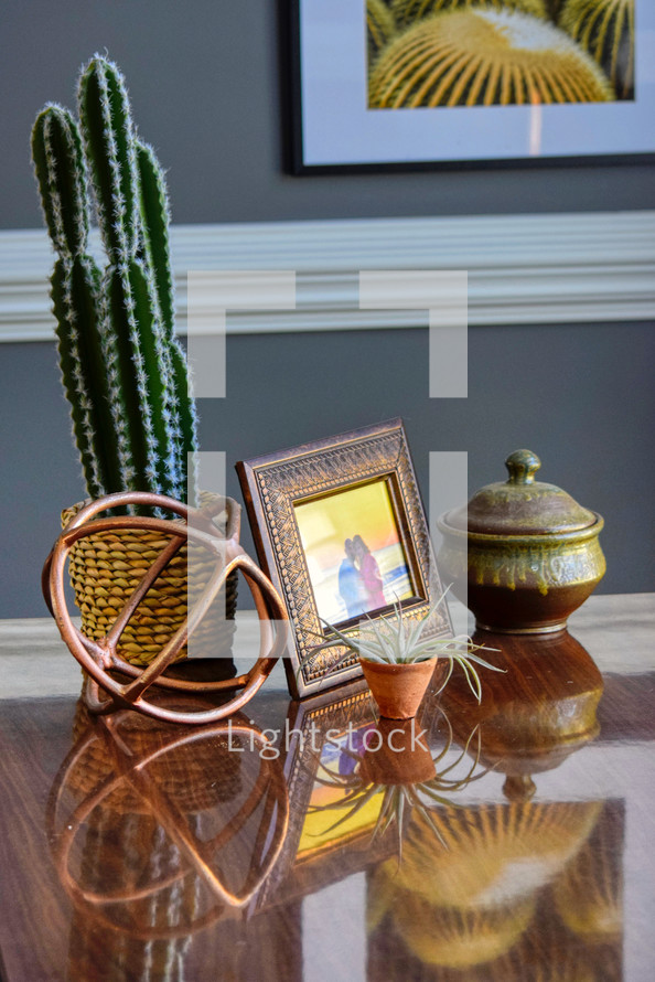 Home office desk with cactus reflection 