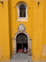 doorway of a yellow building 