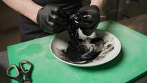 Chef Is Cleaning A Cuttlefish To Extract Black Ink Juice