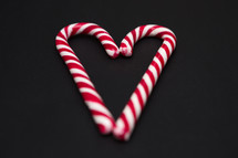 candy cane on a black background 