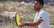 Slow motion of a tennis player hitting the ball during a tennis game