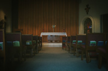 A monstrance on the altar of a Catholic church with the Eucharist 