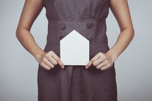 a woman holding an envelope 