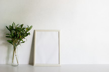 vase of olives and blank frame 
