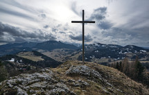 Winter nature panorama, steel cross with religious christian background