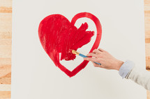 painting a red heart 