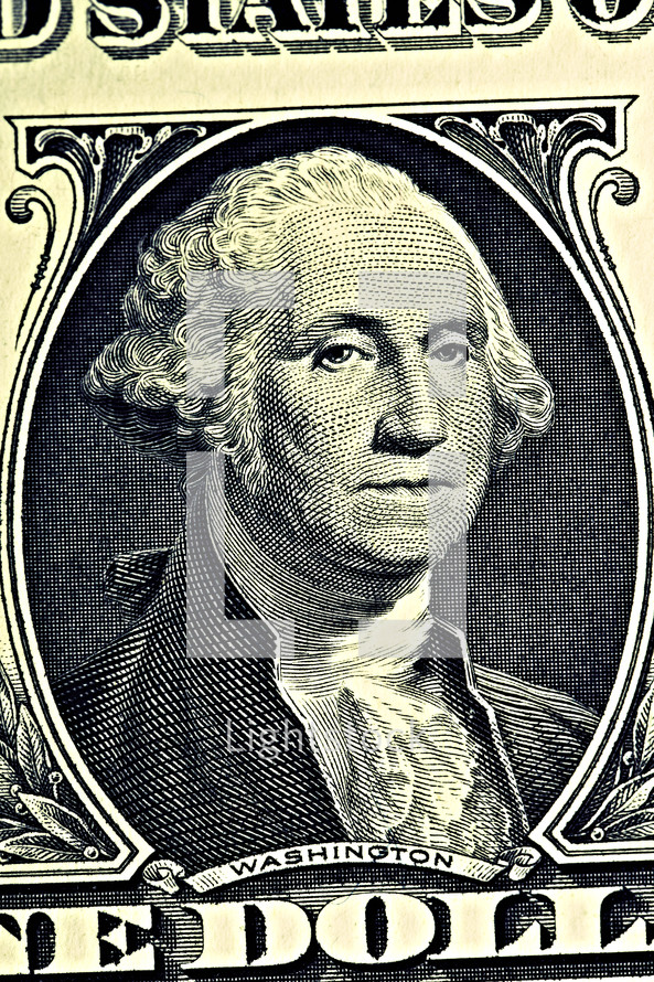 A close up of George Washington on a dollar bill
