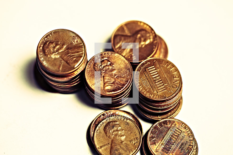 Stacks of pennies isolated on white