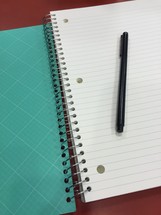 pen on blank pages of a notebook