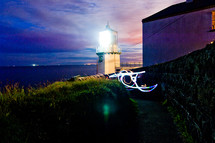 lighthouse beacon light on a coastal evening 