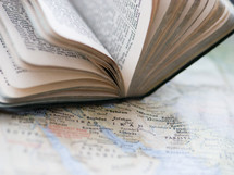 a Bible on a map 