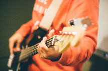 man playing a guitar 